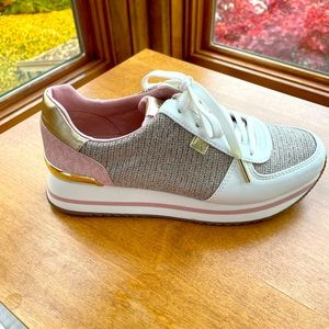 Michael Kors pink and gold tennis shoes.